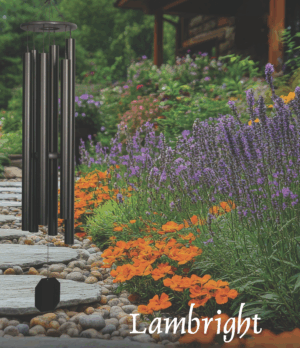 Garden path lined with colorful flowers and black metal posts.