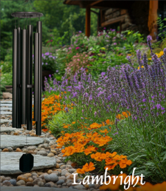 Vibrant garden pathway lined with colorful flowers and black bollards.